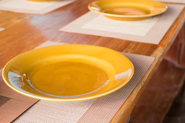 Empty dinner plate front view on wood