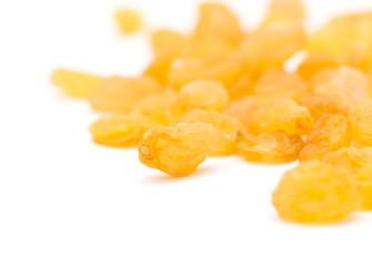 Fototapeta premium Golden raisins on a white background