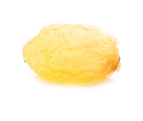 Golden raisins on a white background