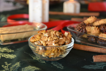 Christmas cookies with chocolate on a decorated table with lighted candles