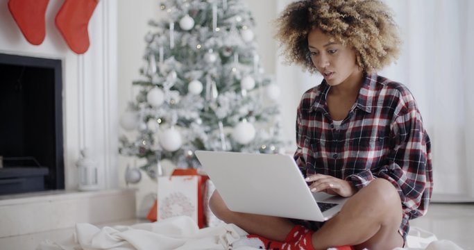 Young African woman relaxing at Christmas time