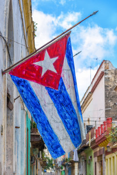 Cuban flag on a shabby street in Havana