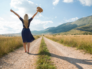 Fototapeta premium Portrait of beautiful girl in field