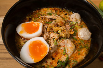 Thai noodle soup in a bowl taste spicy noodle soup and boiled eg