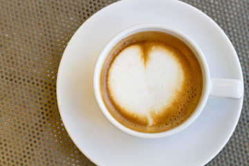 Close up blue cup of Coffee, latte on the steel table 