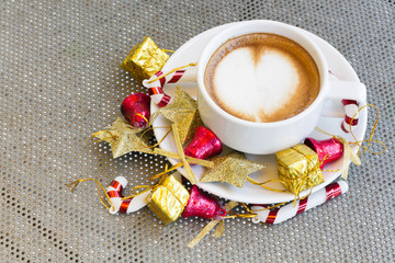 Close up blue cup of Coffee, latte on the steel table with Christmas decorations