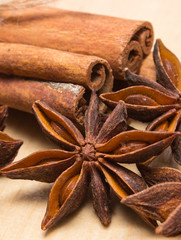 Cinnamon sticks and anise on wooden table, seasoning for cooking