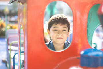 Fototapeta na wymiar Little boy playing at the playground