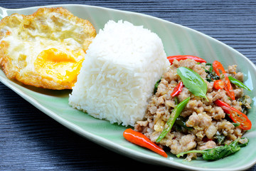 Rice topped with stir-fried pork ,basil and Fried Egg