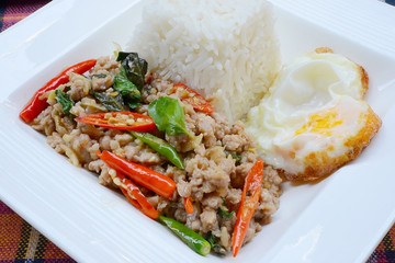 Rice topped with stir-fried pork ,basil and Fried Egg
