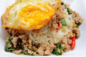Rice topped with stir-fried pork ,basil and Fried Egg