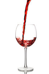 Pouring red wine into a glass