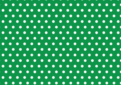 white polka dot on green background