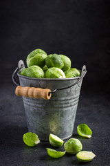 fresh raw brussels sprouts in pail