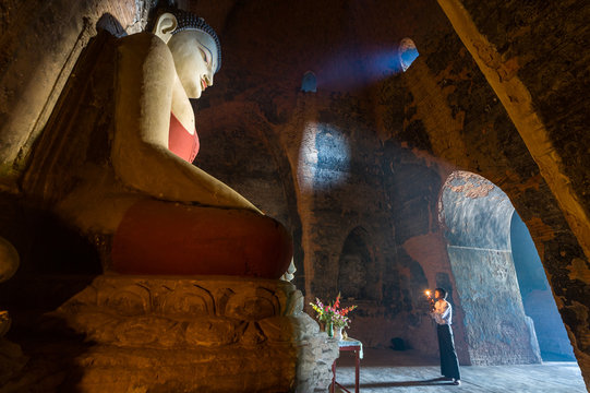 Big buddha statue in meditation inside temple in Bagan Mandalay Myanmar