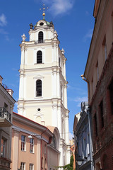 Fototapeta na wymiar Old Town streets and St John's Church in Vilnius University
