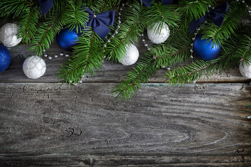 Christmas garland on rustic wooden table with copy space 