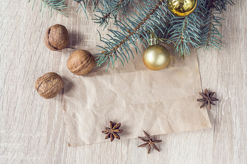 Christmas decorations, walnuts and anise with a blank paper