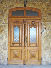 Old brown vintage wooden door with decoration