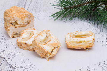 Napoleon cake on a paper napkin openwork