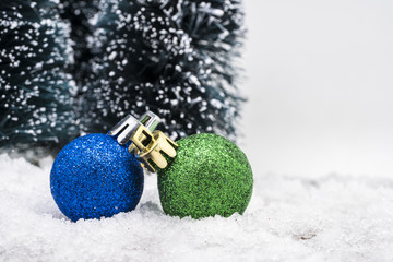 Christmas ornaments on snow