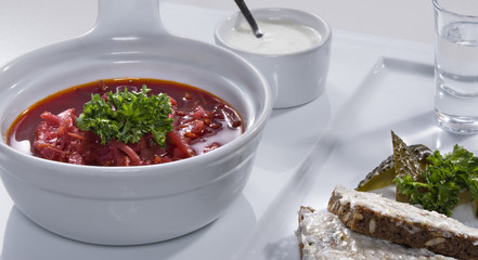 Ukrainian red borscht with salo sandwiches close-up