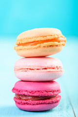 Colorful French Macaroons On Blue Background