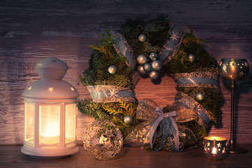 Greeting card design with decorative lantern and Christmas wreat