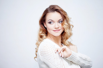 Fototapeta premium Beautiful young blonde woman, laughing and wondering, portrait on white background