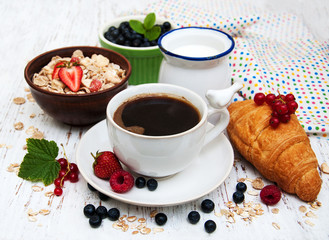 Fresh berries, coffee  and croissant