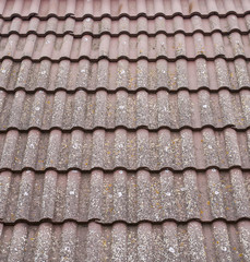 Old roof with ceramic tiles closeup