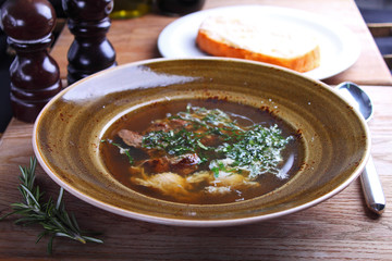soup with meat and greens with egg