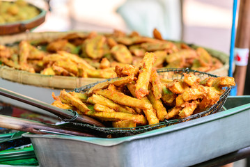 Fries yam cooking for sale at shop.