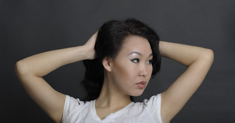 Portrait of asian woman on black background