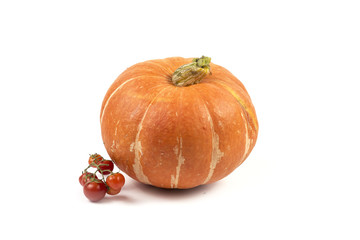 Ripe orange pumpkin and red tomatoes isolated on white