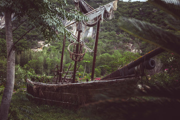 Old pirate sailboat in the jungle.