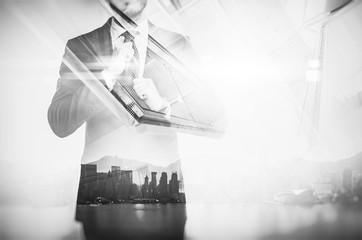 Close-up portrait of businessman straightens his own tie. Double exposure city at sunrise