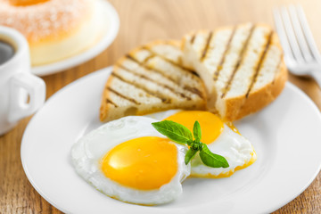 Fried eggs with coffee. Traditional healthy food for breakfast..