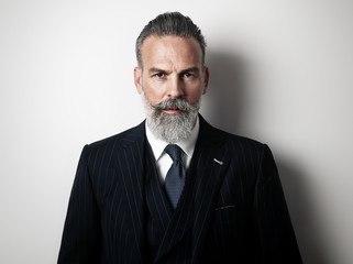 Closeup portrait of a handsome middle aged man wearing suit. 