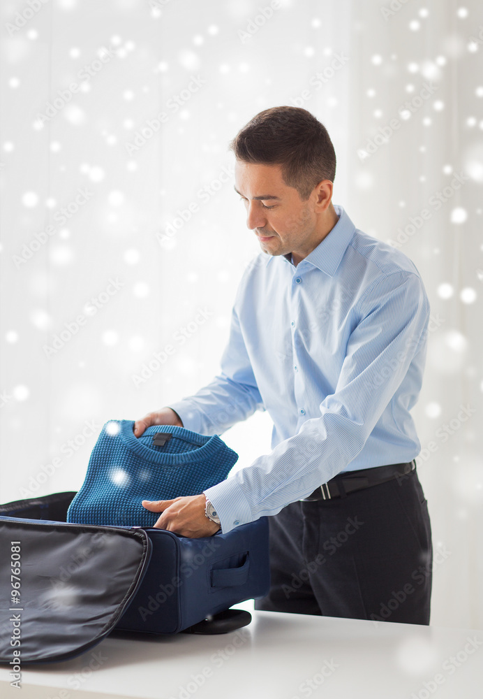 Sticker businessman packing clothes into travel bag