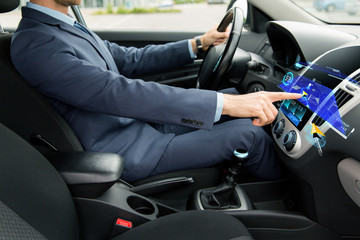 close up of man driving car with navigation