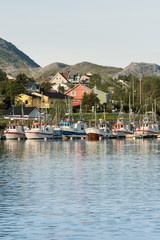 Fototapeta na wymiar Fishing boats in small harbor, Norway