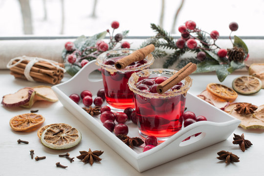 Cranberry drink. Winter mood on the window sill. Winter theme.