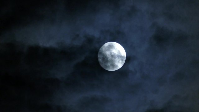 full moon moving between clouds, 4k

