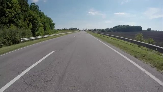 Driving on the highway near the forest