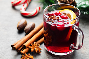 Mulled red wine with spices, cranberries slices 