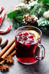 Mulled red wine with spices, cranberries slices 