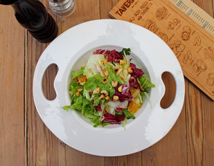 a salad of white , green and red cabbage