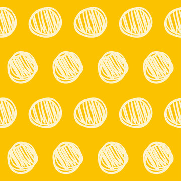 Hand drawn doodle seamless pattern background. Abstract geometric handmade circle shapes isolated on stylish yellow cover for use in design 
