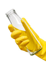 Close up of female hand in yellow protective rubber glove holding empty clean transparent glass milk bottle against white background. Clipping path for bottle border included.